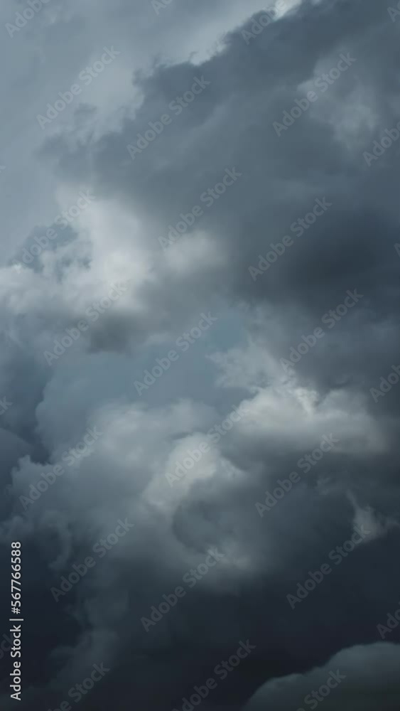 Dramatic dark storm clouds are moving fast, timelapse. Vertical video Dramatic dark storm clouds are moving fast, timelapse. Vertical video