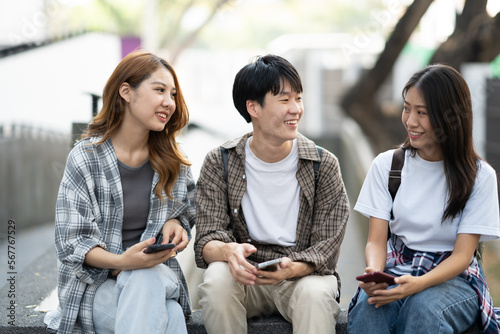 Happy College students taliking together in the campus area, spending time together. photo