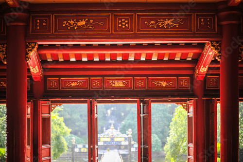 classical vietnamesered wooden interior of a entrance portal chainise style