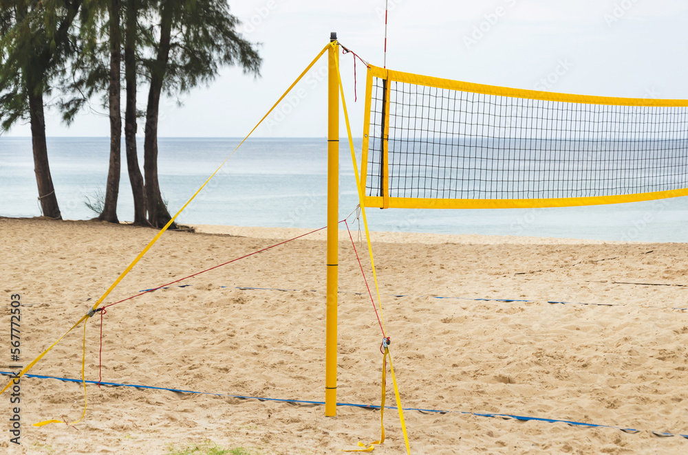 Volleyball mesh on sandy beach on sea background. Inventory for sports outdoor, group sports
