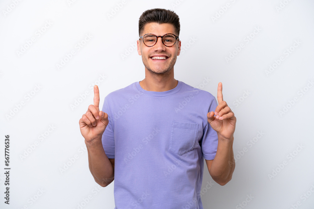 Young caucasian man isolated on white background pointing up a great idea Young caucasian man isolated on white background pointing up a great idea