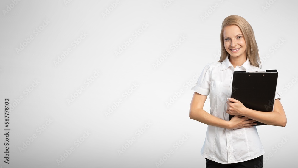 Happy young smart woman posing with clipboard Happy young smart woman posing with clipboard