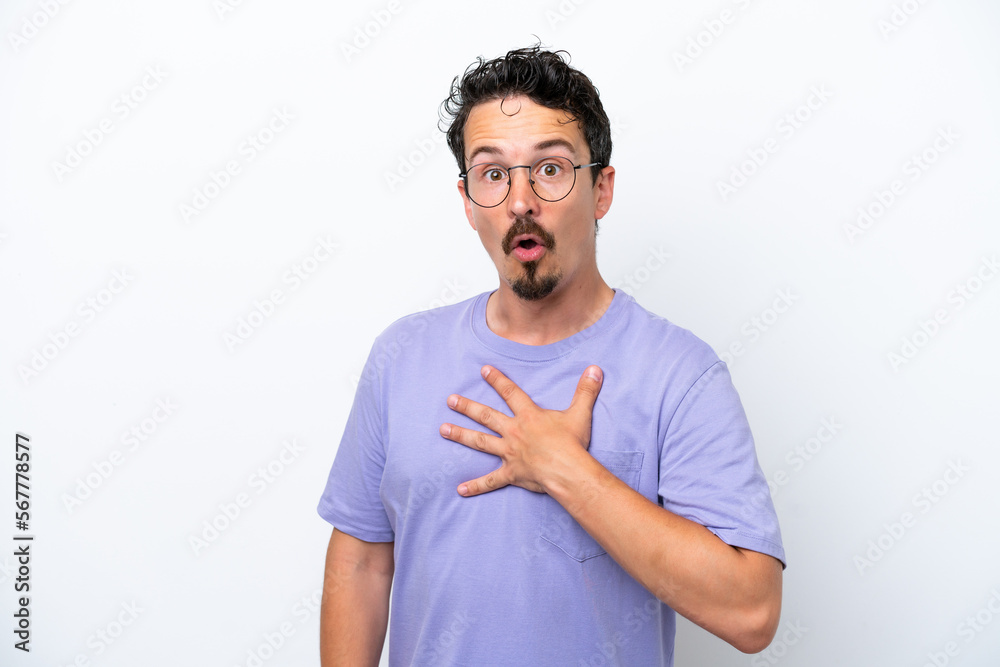 Young man with moustache isolated on white background surprised and shocked while looking right Young man with moustache isolated on white background surprised and shocked while looking right