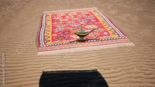 A magic carpet flying over the desert with a gold magic genie lamp sitting on the front.