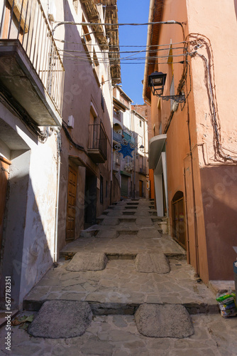 Old street with stairs and ramps for cars in a small town in Catalonia © Joan Manel Moreno