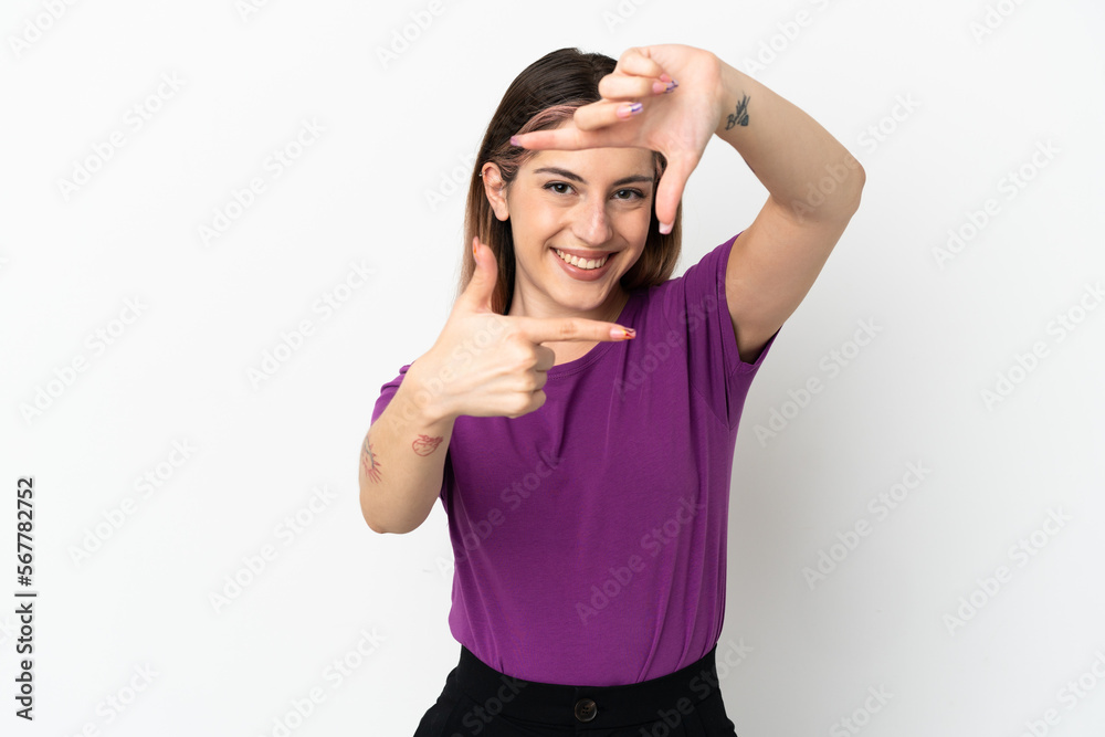 Young caucasian woman isolated on white background focusing face. Framing symbol Young caucasian woman isolated on white background focusing face. Framing symbol