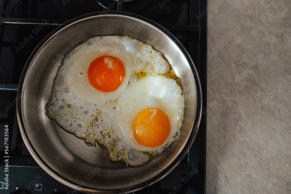 fry scrambled eggs in a steel pan fry scrambled eggs in a steel pan