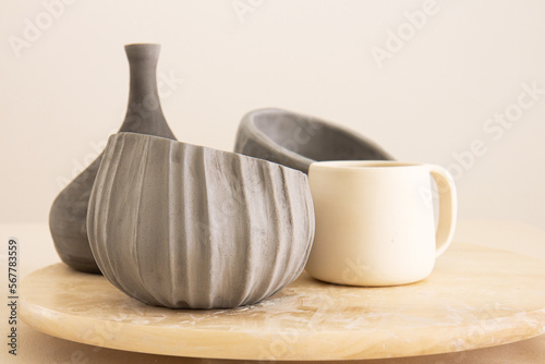 Ceramic crockery and craft pottery cups. Handicraft clay earthenware bowls photo