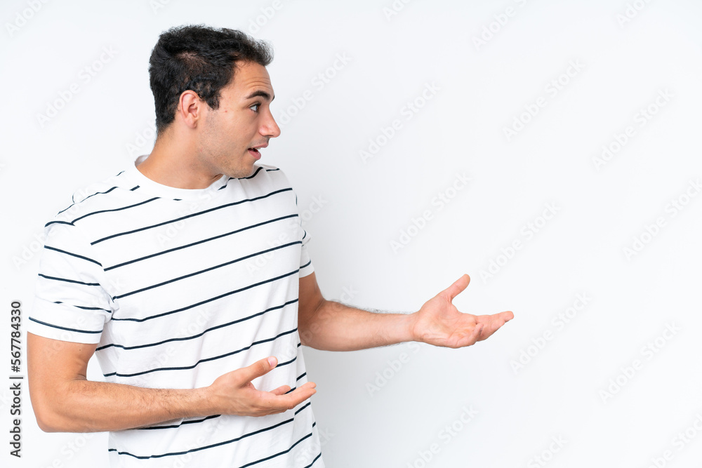 Young caucasian man isolated on white background with surprise expression while looking side Young caucasian man isolated on white background with surprise expression while looking side
