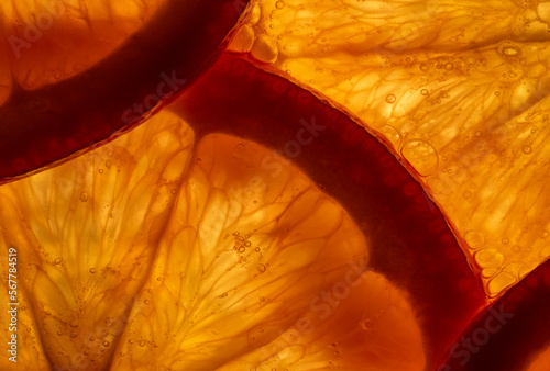 juicy slices of orange, macro photography photo