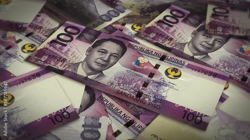 Pile of philippines peso cash money, inflation concept. Closeup new philippines one hundred peso bills 4k resolution