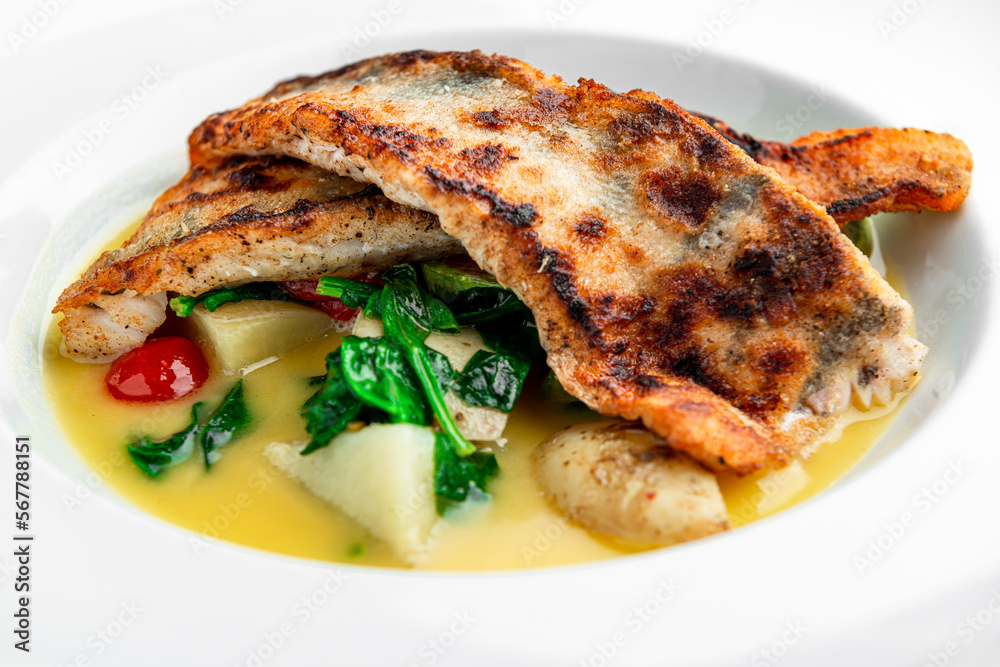 Fried perch fillet with boiled potatoes in a creamy sauce Fried perch fillet with boiled potatoes in a creamy sauce