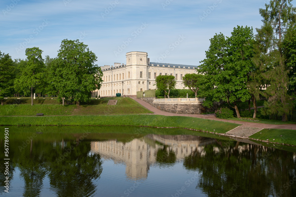 Palace and park ensemble of Gatchina Park: Karpin Pond, Gatchina Palace, private palace garden on a sunny summer day, Gatchina, St. Petersburg, Russia
