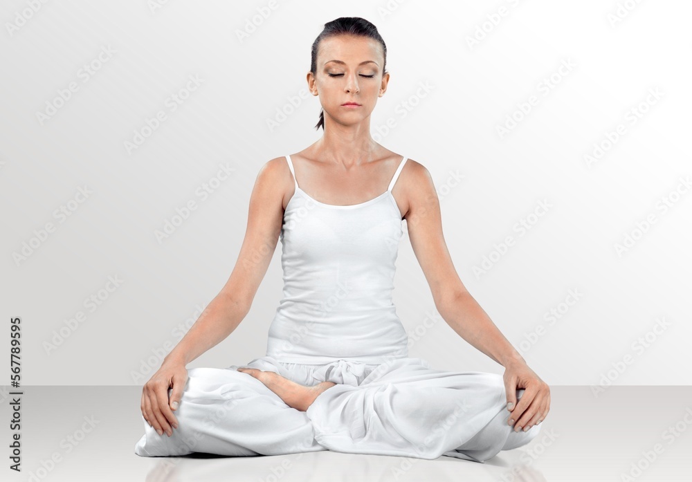 Young happy female practicing yoga at home Young happy female practicing yoga at home