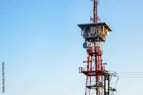 GSM antennas on a high tower against the blue sky, 5g, 4g antennas for cellular communication