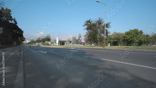Police car with rotating lights passing the street