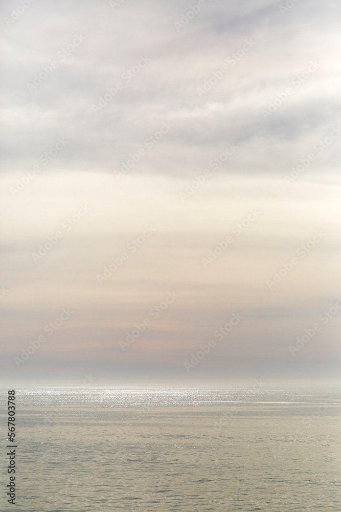 Abstract Dreamy Pastel Clouds and Shimmering Sea at Sunset