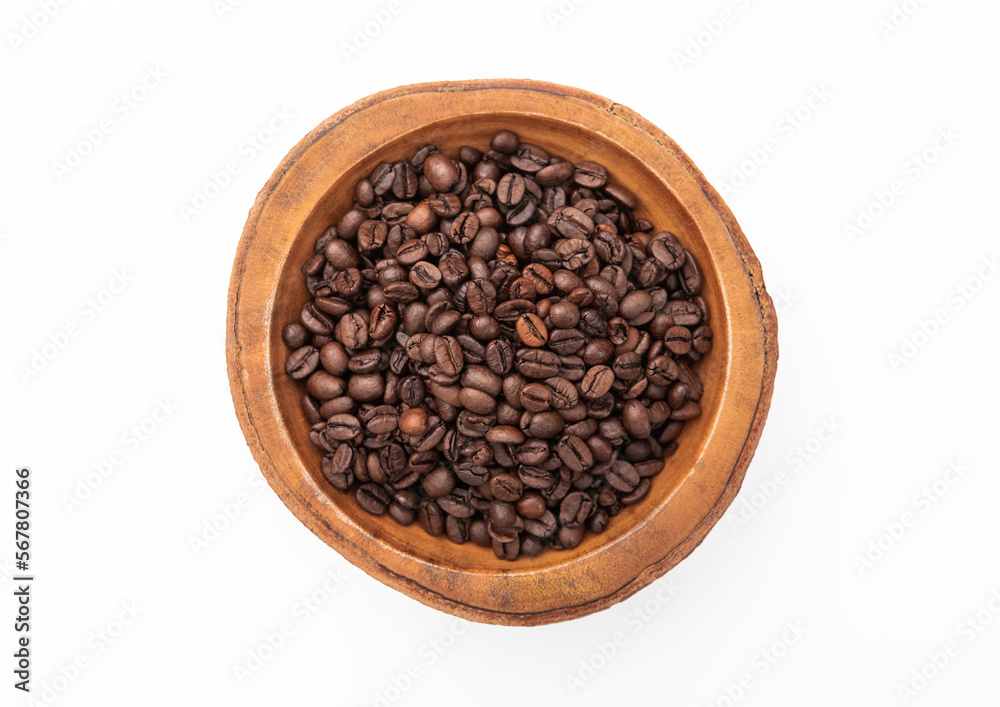 Fototapeta premium Raw coffee beans in wooden bowl plate on white background.