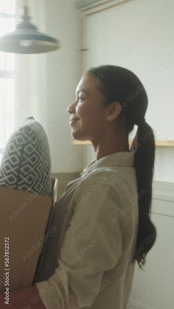 Adult Female Moving into New Home Carrying Cardboard Boxes Adult Female Moving into New Home Carrying Cardboard Boxes