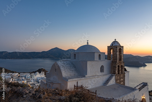 Panoramic view on Plaka village and the bay from the Venetian castle at dusk, Milos island GR 