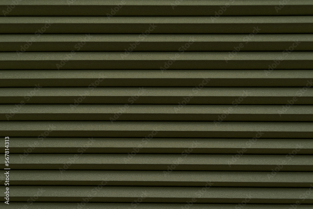 Roller blinds on the window. The texture of roller blinds. Background of stripes Roller blinds on the window. The texture of roller blinds. Background of stripes