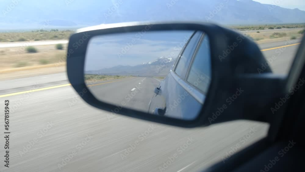 driver's point of view in vehicle rearview mirror view view empty road with mountain landscape national park concept adventure lonely reflection travel metaphor journey through life look back driver's point of view in vehicle rearview mirror view view empty road with mountain landscape national park concept adventure lonely reflection travel metaphor journey through life look back