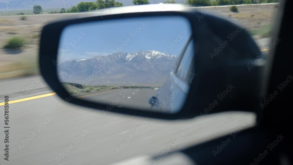 driver's point of view in vehicle rearview mirror view view empty road with mountain landscape national park concept adventure lonely reflection travel metaphor journey through life look back driver's point of view in vehicle rearview mirror view view empty road with mountain landscape national park concept adventure lonely reflection travel metaphor journey through life look back