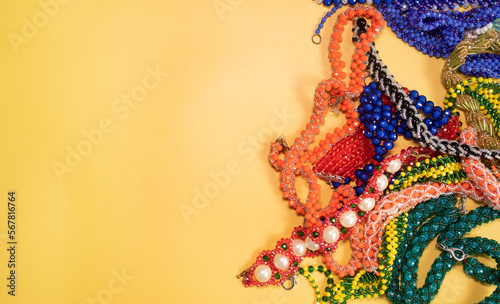 Beads, Jewelery, beads necklace on yellow background. 