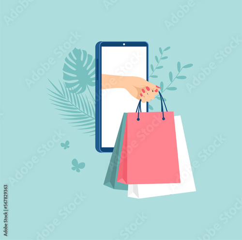 Female hand with packages coming out of smartphone screen. The concept of online shopping. Flat vector illustration
