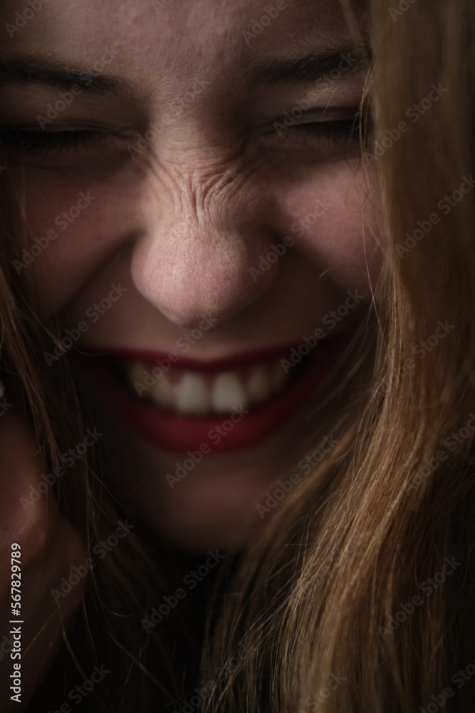 Face portraits of young beautiful girl. Hands near the face. Closed eyes. Happy girl have a fun