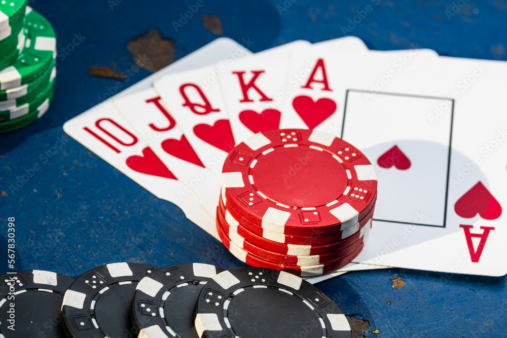 Obraz premium Stacks of poker chips with money and cards