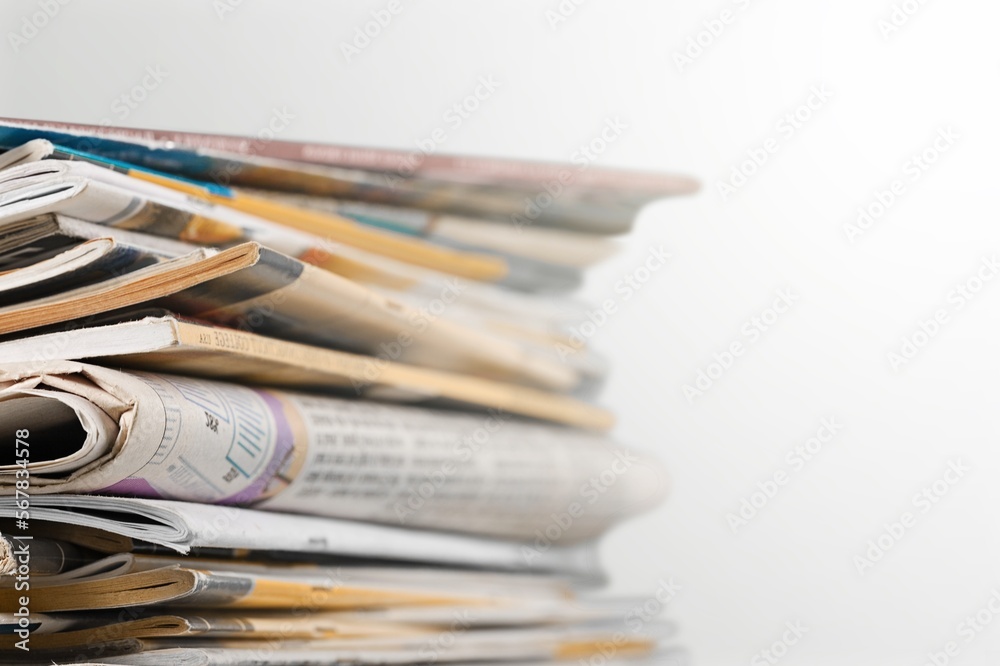A pile of dusty, old magazines on background A pile of dusty, old magazines on background