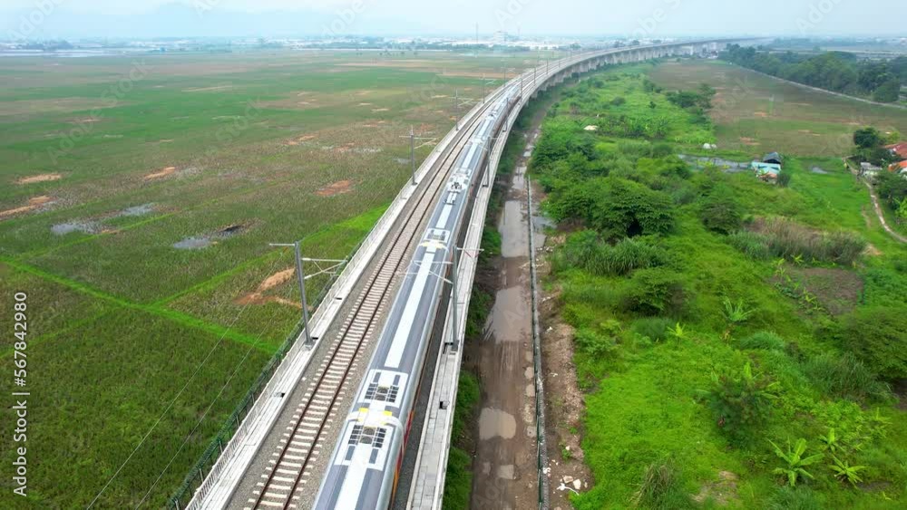 Aerial view of the High speed orange train on the railway station. High Speed Train Jakarta-Bandung