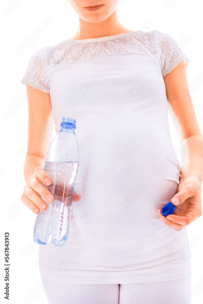 beautiful young pregnant girl on a white background with a bottle beautiful young pregnant girl on a white background with a bottle