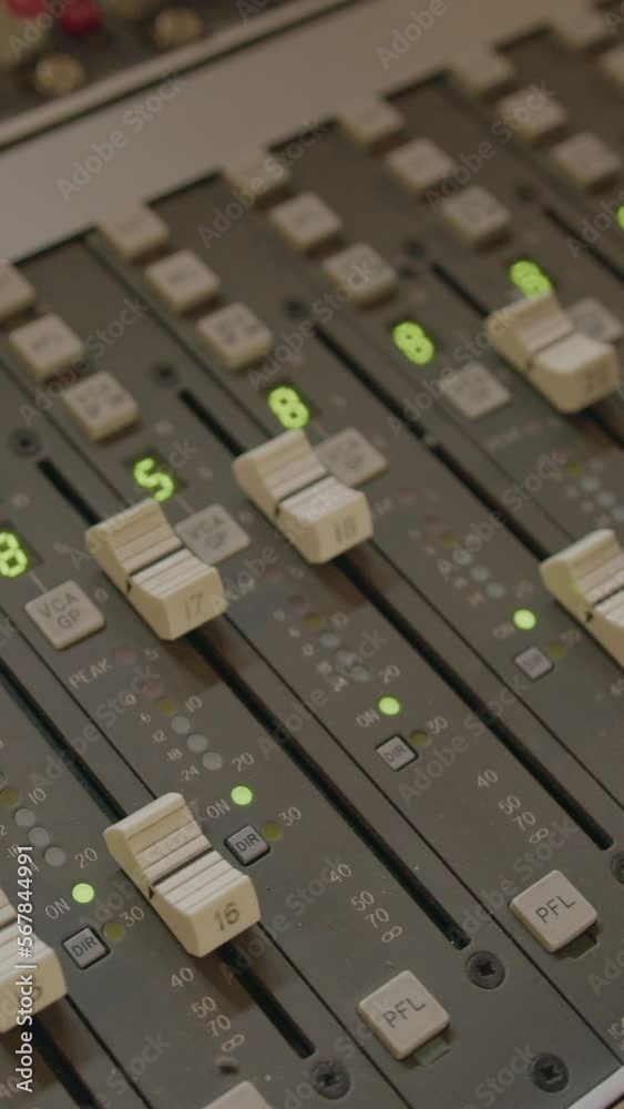Music Recording Studio Mixing Panel with Hand on Fader Music Recording Studio Mixing Panel with Hand on Fader