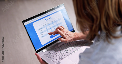 Woman Looking At Online Computer Survey