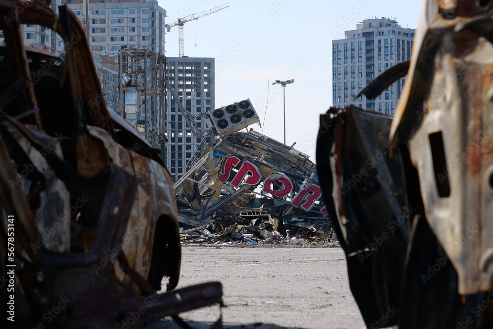 Fototapeta premium Russian missile destroyed cars and shopping center Retroville in Kyiv, Ukraine