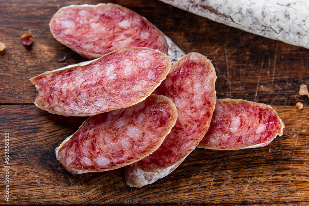Fuet sausage cured spanish meat product meal food snack on the table copy space food background rustic top view Fuet sausage cured spanish meat product meal food snack on the table copy space food background rustic top view