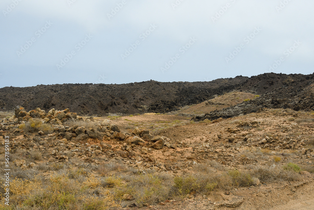 Contrast between a modern lava front and land unaffected by the eruption in Lanzarote