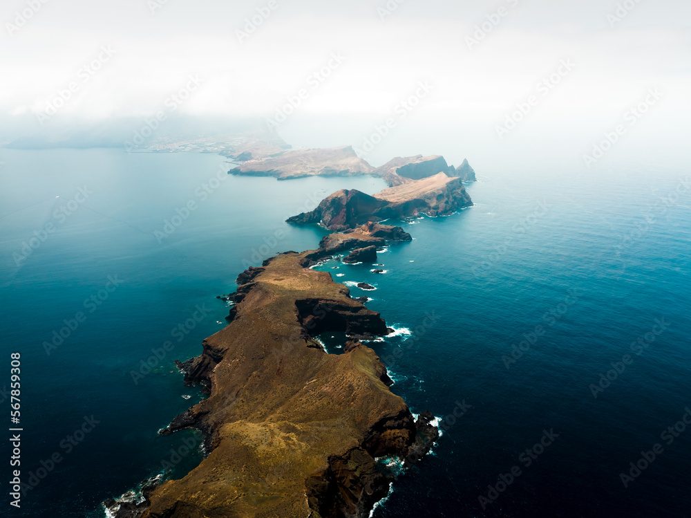 Ponta de São Lourenço is the easternmost part of the island of Madeira . It has the shape of a narrow isthmus passing into two islets ,shot from drone, ocean
