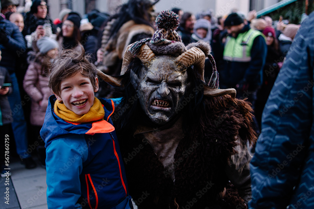 Procession of the Krampus Bavarian tradition in Germany. Costume parade fashing procession. Scary demon make-up with horns for halloween. Zombie parade. Terrible scary masks. Folk German folklore