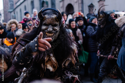 Procession of the Krampus Bavarian tradition in Germany. Costume parade fashing procession. Scary demon make-up with horns for halloween. Zombie parade. Terrible scary masks. Folk German folklore