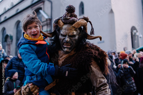 Procession of the Krampus Bavarian tradition in Germany. Costume parade fashing procession. Scary demon make-up with horns for halloween. Zombie parade. Terrible scary masks. Folk German folklore