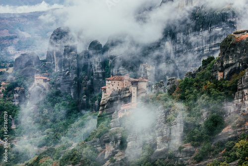 A monastery on the rocky mountains hidden in the mist