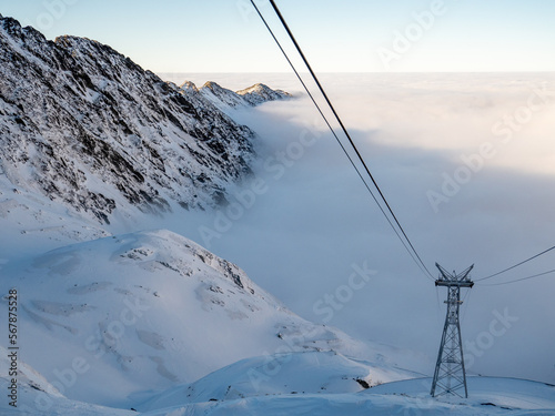 snow covered mountains in winter in a see of fog, fagaras mountains from near balea lake, romania   © pfongabe33