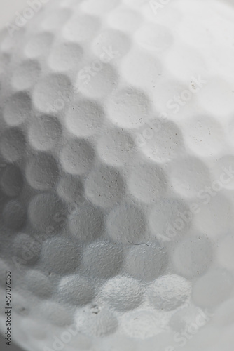 Close up of white golf ball with pattern and detail and copy space