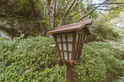 Wooden Japanese lantern in the garden. Tropical vegetation. © Stefan Lambauer