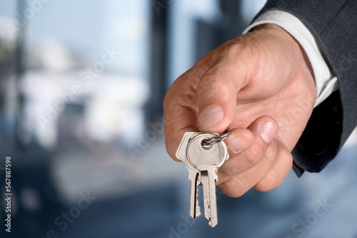 Real estate worker hold keys from apartment