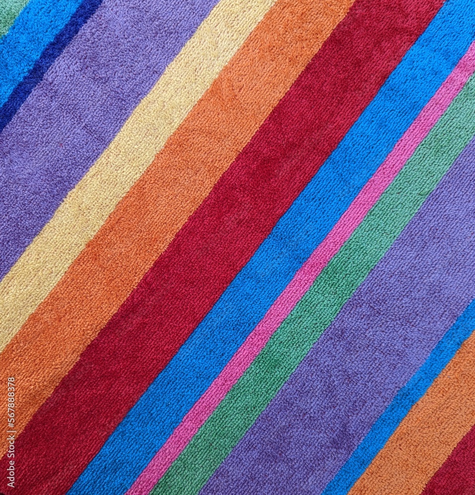 Fototapeta premium Colorful striped towel closeup. Full frame diagonals