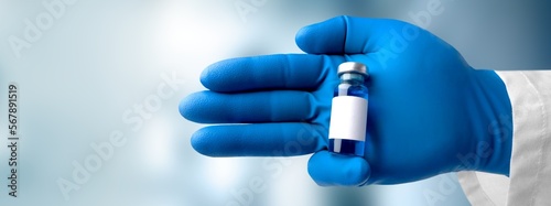 Fototapeta Naklejka Na Ścianę i Meble -  Experimental medical vaccine vial in doctor's hands